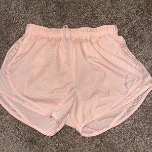 Pink Nike running shorts